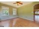 A spare room with hardwood floors and many windows for light at 1615 Clairmont Sw Ln, Conyers, GA 30094