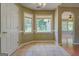 Bright breakfast nook with bay windows offers a view of the backyard at 1615 Clairmont Sw Ln, Conyers, GA 30094