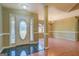 Bright entryway features tile flooring, a decorative front door, and views into the adjacent dining room at 1615 Clairmont Sw Ln, Conyers, GA 30094