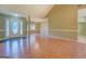 Open-concept living area with a bright front door and hardwood floors at 1615 Clairmont Sw Ln, Conyers, GA 30094