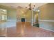 Spacious living room featuring high ceilings, a cozy fireplace, and sleek, light-colored flooring at 1615 Clairmont Sw Ln, Conyers, GA 30094