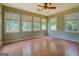 The bright sunroom with many windows and a ceiling fan at 1615 Clairmont Sw Ln, Conyers, GA 30094