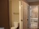 View from the doorway looking into a full bathroom with a tub and tile flooring at 1627 Orlando Sw St, Atlanta, GA 30311