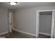Bedroom with carpet flooring and a closet and hallway to an adjacent room at 1627 Orlando Sw St, Atlanta, GA 30311