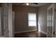 Bright bedroom with hardwood floors, window, and natural light from the french doorway at 1627 Orlando Sw St, Atlanta, GA 30311