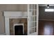 Living room with fireplace and glass door leading to the other room at 1627 Orlando Sw St, Atlanta, GA 30311