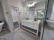 Spacious bathroom showcasing a walk-in shower, soaking tub, and dual vanities with modern fixtures at 7910 Tintern Trce, Duluth, GA 30097