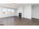 Large living space featuring a fireplace, hardwood floors, and windows at 509 Altahama, Locust Grove, GA 30248