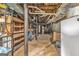 Unfinished basement with exposed utilities and storage shelves at 708 Delanie Way, Stone Mountain, GA 30083
