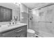 Modern bathroom featuring a glass shower, marble countertop, and stylish vanity for a sleek design at 708 Delanie Way, Stone Mountain, GA 30083