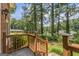 Charming deck overlooking the backyard, surrounded by lush greenery and mature trees at 708 Delanie Way, Stone Mountain, GA 30083