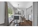 Charming dining area with barstool seating and ample natural light adjacent to kitchen and laundry at 708 Delanie Way, Stone Mountain, GA 30083