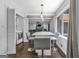 Bright dining area with modern lighting and a view into the living room at 708 Delanie Way, Stone Mountain, GA 30083