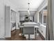 Bright dining area with barstool seating, seamlessly connected to the adjacent open living room and kitchen at 708 Delanie Way, Stone Mountain, GA 30083