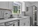 Kitchen features modern stainless steel appliances, sleek countertops, and bright natural light at 708 Delanie Way, Stone Mountain, GA 30083