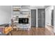 Cozy living room with dark floors, white shelving, and gray doors providing ample storage and style at 708 Delanie Way, Stone Mountain, GA 30083
