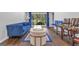 Stylish living room with modern furniture, hardwood floors, and bright blue accents at 708 Delanie Way, Stone Mountain, GA 30083