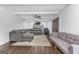 Comfortable living room with an exposed-beam ceiling, stylish furniture, and cozy fireplace focal point at 708 Delanie Way, Stone Mountain, GA 30083