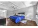 A spacious bedroom with a ceiling fan, hardwood floors, and access to an attached bathroom at 708 Delanie Way, Stone Mountain, GA 30083