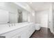 Bright bathroom featuring a double vanity, soaking tub, and glass shower at 714 Ocmulgee Crossing, Locust Grove, GA 30248