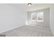 Bedroom with neutral carpeting and a window with a view at 714 Ocmulgee Crossing, Locust Grove, GA 30248