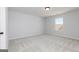 Bedroom with neutral carpeting and a window with a view at 714 Ocmulgee Crossing, Locust Grove, GA 30248