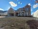 Brick two-story home with white trim, well-manicured lawn and attached garage at 714 Ocmulgee Crossing, Locust Grove, GA 30248