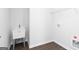 Laundry room with vinyl flooring and a utility sink at 714 Ocmulgee Crossing, Locust Grove, GA 30248