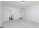 Spacious main bedroom with neutral carpet and ensuite bathroom at 714 Ocmulgee Crossing, Locust Grove, GA 30248