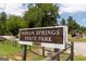 The sign for Indian Springs State Park featuring trees in the background at 714 Ocmulgee Crossing, Locust Grove, GA 30248