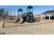 Outdoor playground with slides, climbing structures, and a bench, offering a fun recreational space at 714 Ocmulgee Crossing, Locust Grove, GA 30248