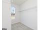 Walk-in closet featuring installed wire shelving and a window at 714 Ocmulgee Crossing, Locust Grove, GA 30248
