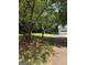 Image of a home's multi-car garage and some of the surrounding lawn and property at 276 Appalachee Church Rd, Auburn, GA 30011