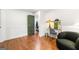 View of the finished basement with hardwood floors, wainscoting, and a decorative fish tank at 216 Leyden St, Decatur, GA 30030