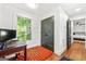 Bright bedroom with large window providing ample natural light, and hardwood floors at 216 Leyden St, Decatur, GA 30030