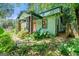 Charming home with colorful door, inviting front porch, and lush landscaping at 216 Leyden St, Decatur, GA 30030