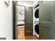 Hallway Laundry setup with stacked washer/dryer located near the primary bedroom at 216 Leyden St, Decatur, GA 30030