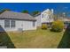 Landscaped backyard featuring a fenced yard and well-kept lawn at 2375 Lexington Ln, Cumming, GA 30040