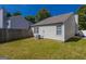 A well-maintained backyard with grass and partial privacy fence at 2375 Lexington Ln, Cumming, GA 30040