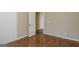 Bedroom with wood-look floors, neutral paint and an open doorway at 2375 Lexington Ln, Cumming, GA 30040