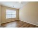 This bedroom features hardwood floors, neutral paint, and a ceiling fan at 2375 Lexington Ln, Cumming, GA 30040