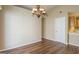 Inviting dining room with wood floors, neutral paint, and an ornate light fixture at 2375 Lexington Ln, Cumming, GA 30040