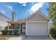Charming single-Gathering home with a manicured lawn, one-car garage, and inviting front porch at 2375 Lexington Ln, Cumming, GA 30040