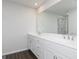 Bright bathroom featuring a double vanity with white cabinets and a marble-tiled walk-in shower at 121 Chattahoochee Circle, Locust Grove, GA 30248