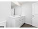 Bathroom with double vanity and dark wood-style floors at 121 Chattahoochee Circle, Locust Grove, GA 30248