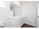 Stylish bathroom features a double vanity with modern fixtures and wood-look flooring at 121 Chattahoochee Circle, Locust Grove, GA 30248