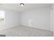 Empty bedroom with carpeted floors and a small door on the back wall at 121 Chattahoochee Circle, Locust Grove, GA 30248
