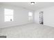 Spacious bedroom with carpet flooring and natural light from windows at 121 Chattahoochee Circle, Locust Grove, GA 30248