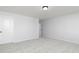 Cozy bedroom with neutral carpet, white walls, and a ceiling light fixture at 121 Chattahoochee Circle, Locust Grove, GA 30248