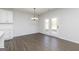 Open dining area featuring modern lighting fixture and french doors at 121 Chattahoochee Circle, Locust Grove, GA 30248